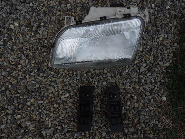 ox_toyota-corolla-verso-lampa-lewa-i-panele-wylacznikow-szyb